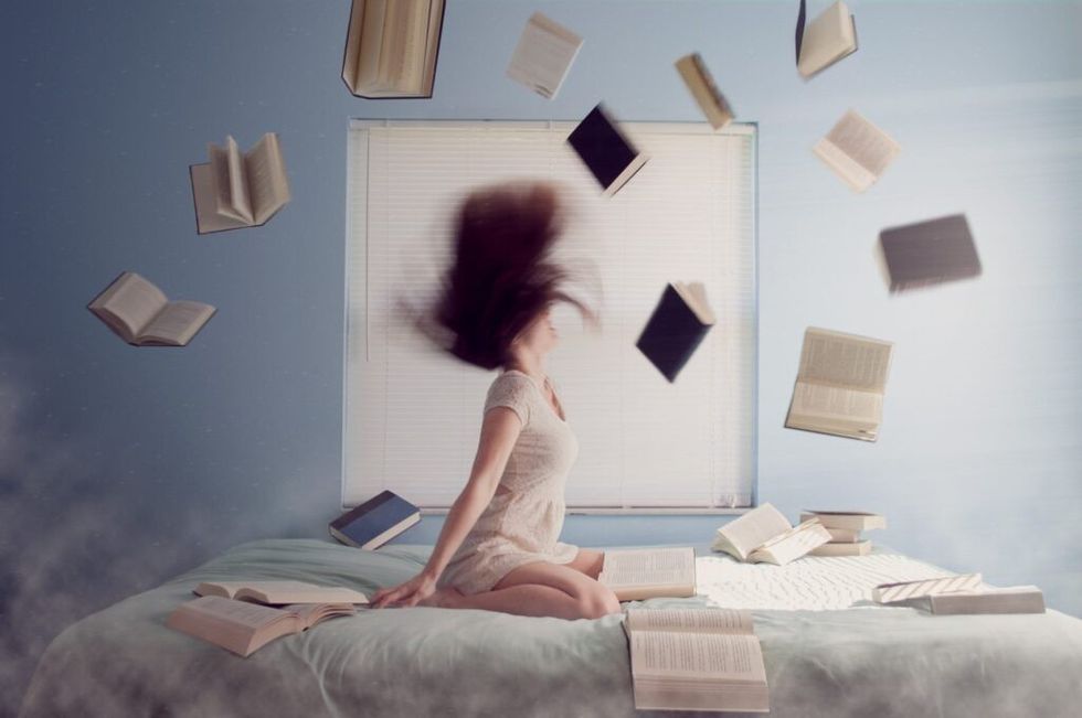 woman-surrounded-by-several-books-at-the-same-time