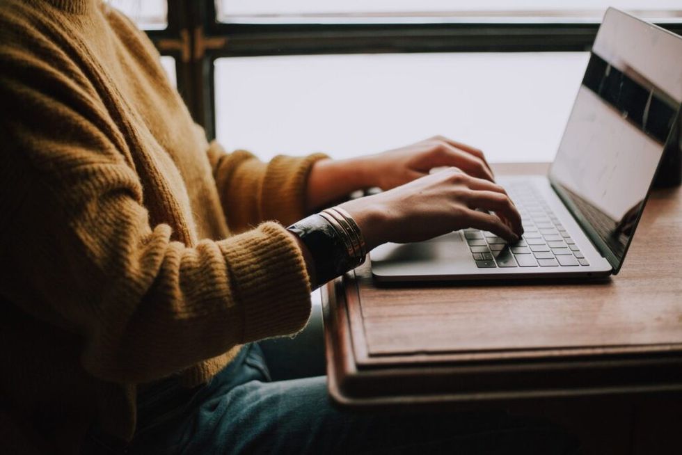 Woman-writing-on-laptop