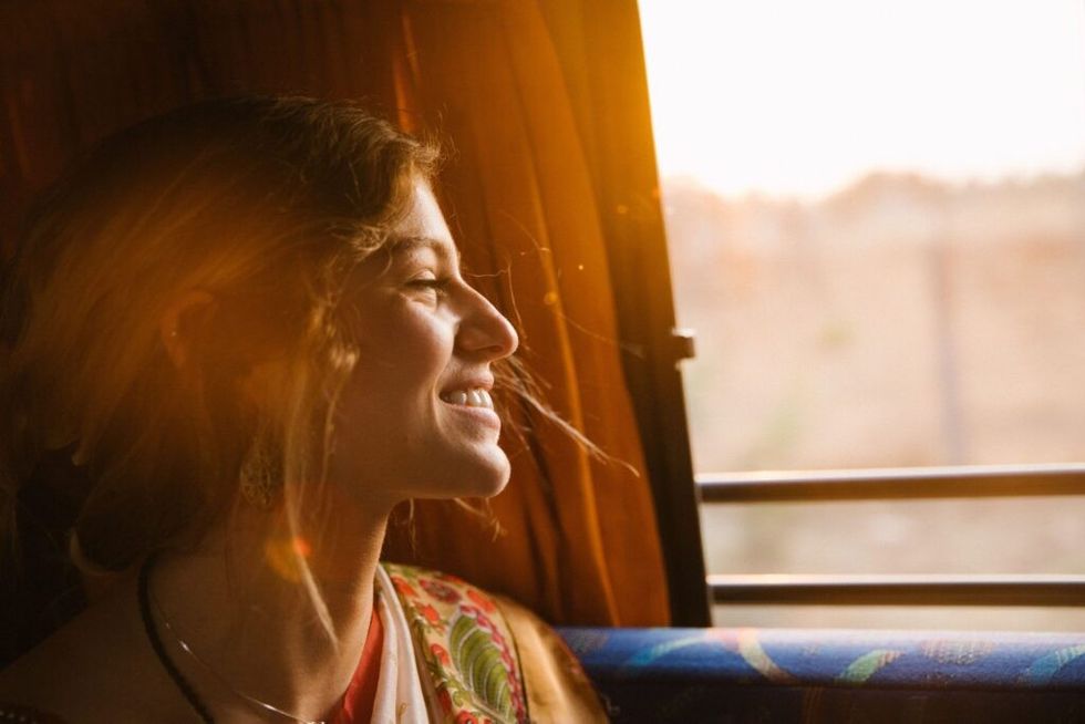 Woman-smiling-out-the-window