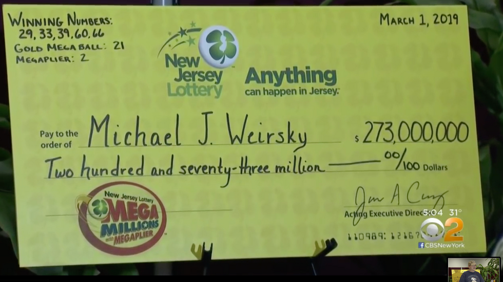 a big yellow lottery cheque