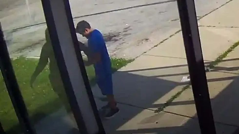 a boy and a woman skateboarding