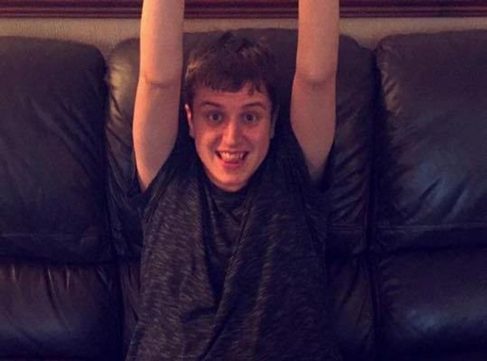 a boy sitting on a couch