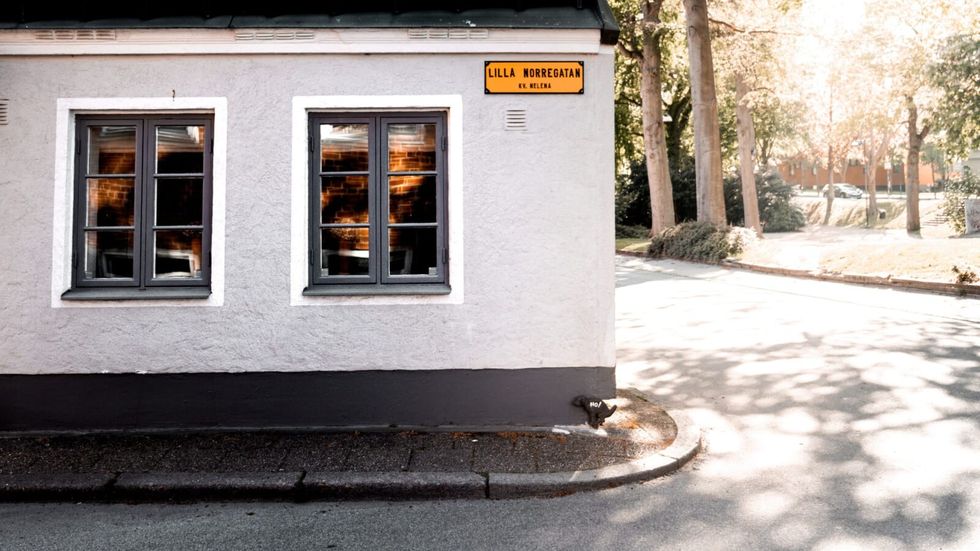 a building at the corner of a road