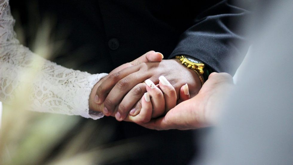 a couple holding hands