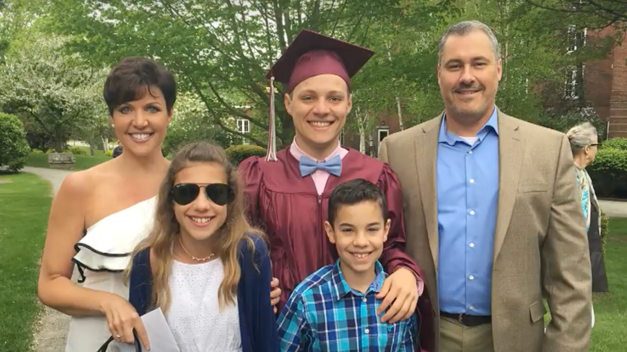 A man and woman with three young kids.