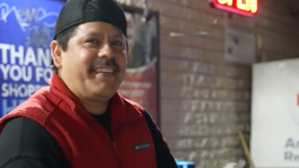 a man wearing a black and red outfit