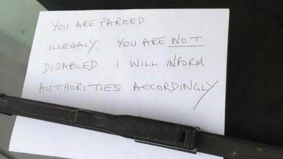 a note placed on a windshield