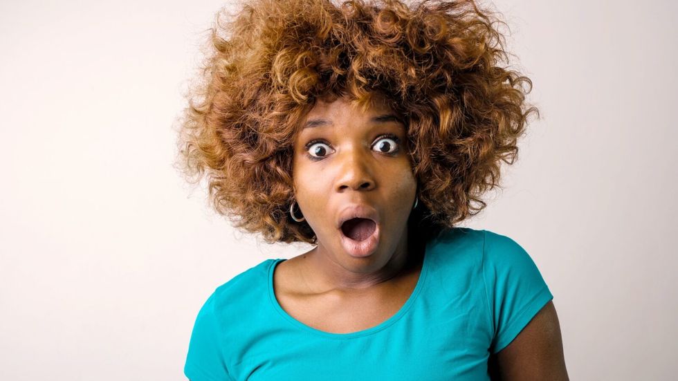 a woman with a surprised look