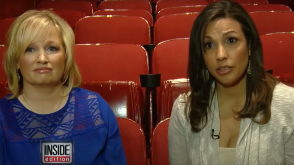 a woman with blond hair and a woman with brown hair sitting in a movie theatre