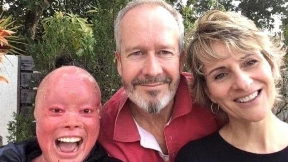 a young woman with her adoptive parents