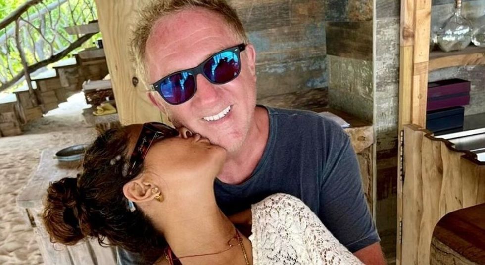 Actress Salma Hayek and husband Francois-Henri Pinault kissing and celebrating their anniversary.