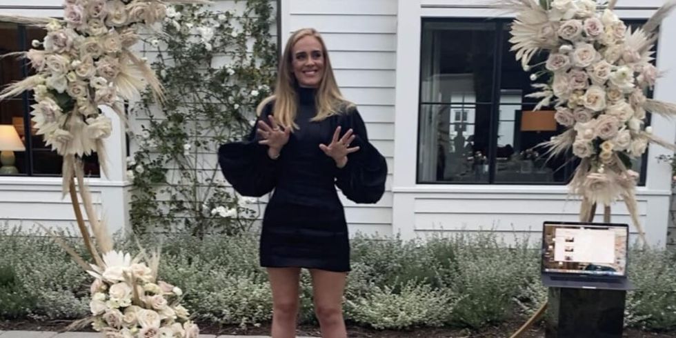 Adele in black dress smiling