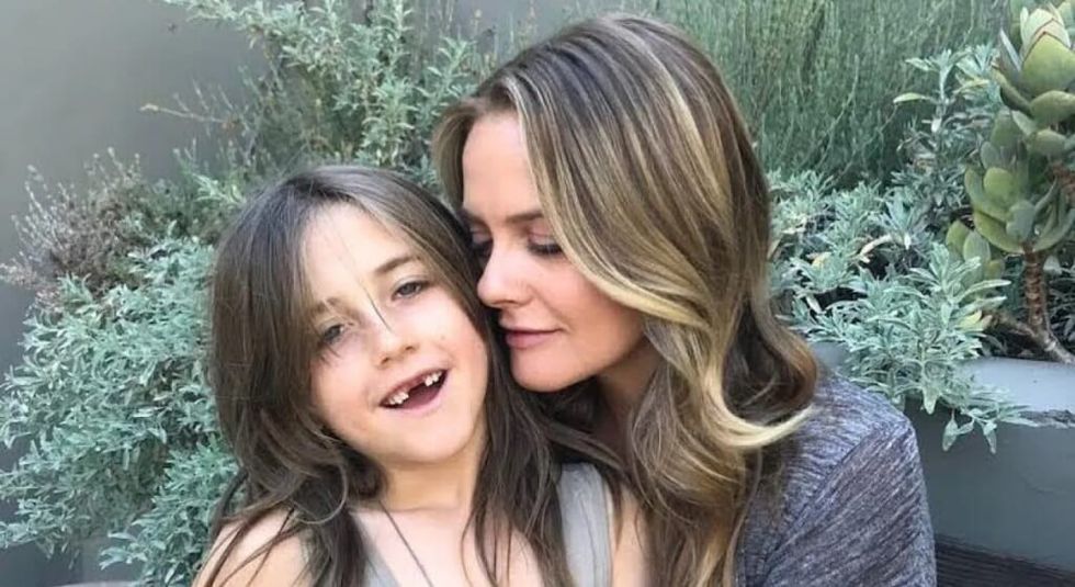 Alicia Silverstone hugging her son Bear.