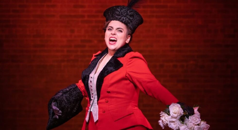 Beanie Feldstein as Fanny Price in Funny Girl in red dress