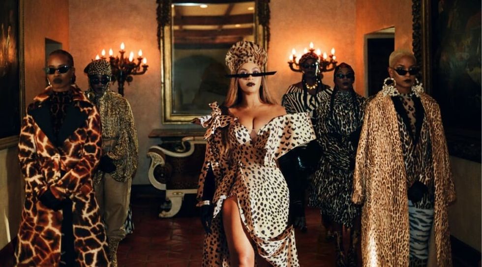 Beyonce Black is King wearing animal print dress.