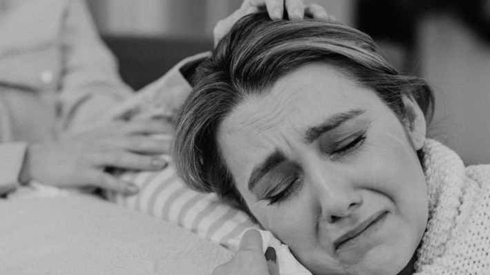 black and white picture of a woman crying