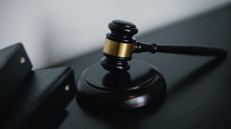 black gavel on a black table