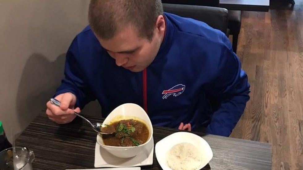 boy eating a meal at a restaurant