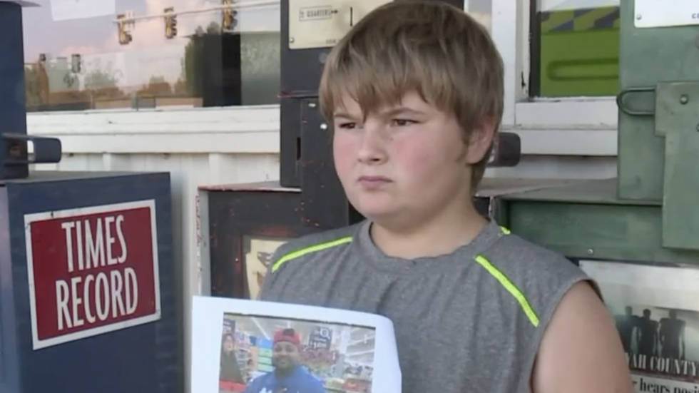 boy holding a photograph