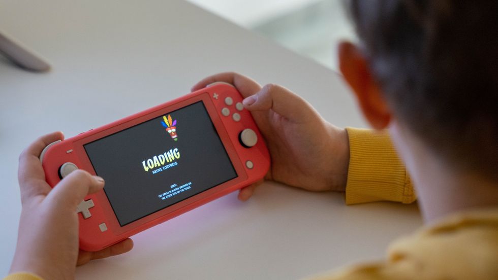 boy playing with a nintendo