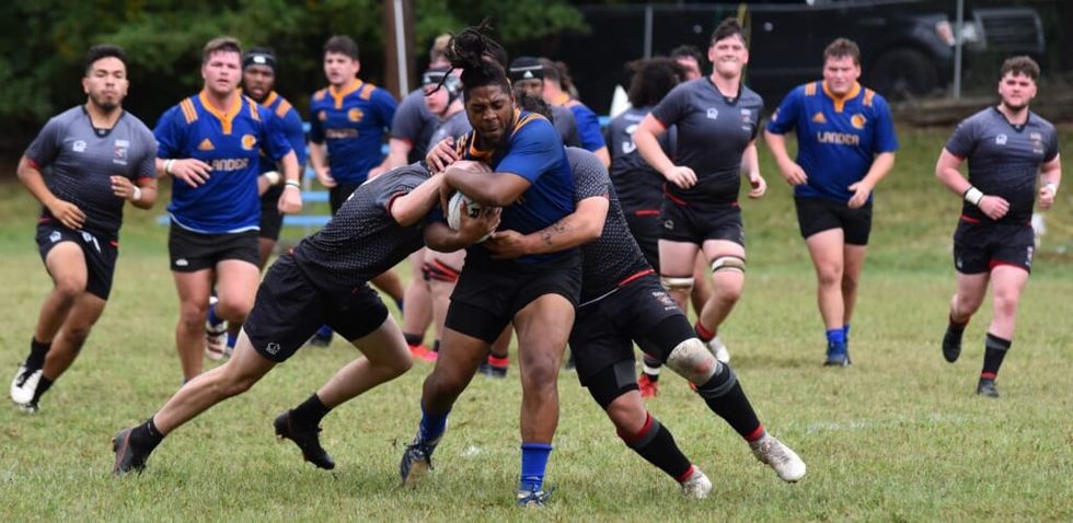 boys play rugby outdoors