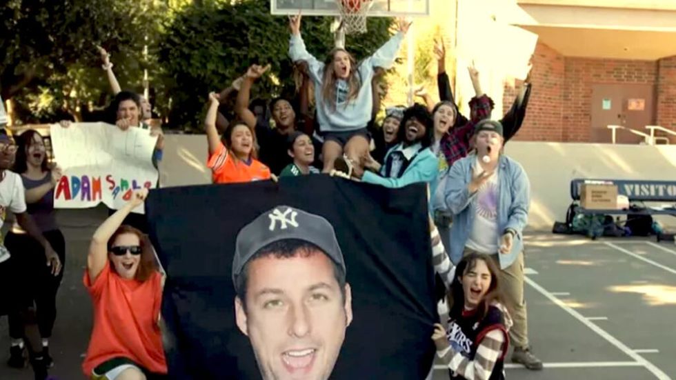 Charloette Jolley poses with friends while getting Adam Sandler's attention