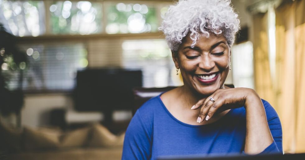 Cheerful woman on video call at home