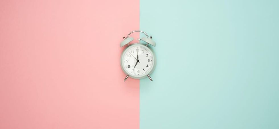 clock on pastel background