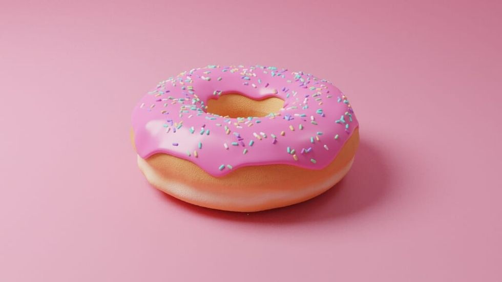 close up of donut pink frosting