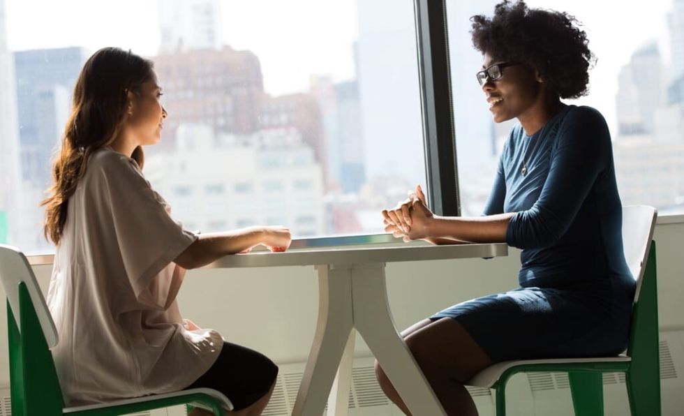 co-workers in conversation