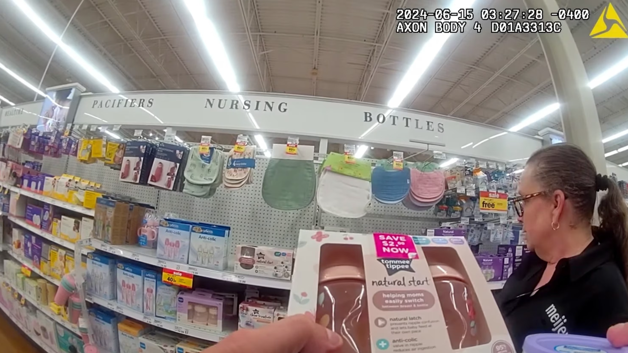 Corporal Willoughby purchases formula and baby bottles for mom in need with the help of Meijer staff.