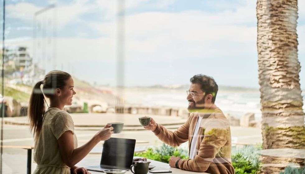 couple have coffee outside