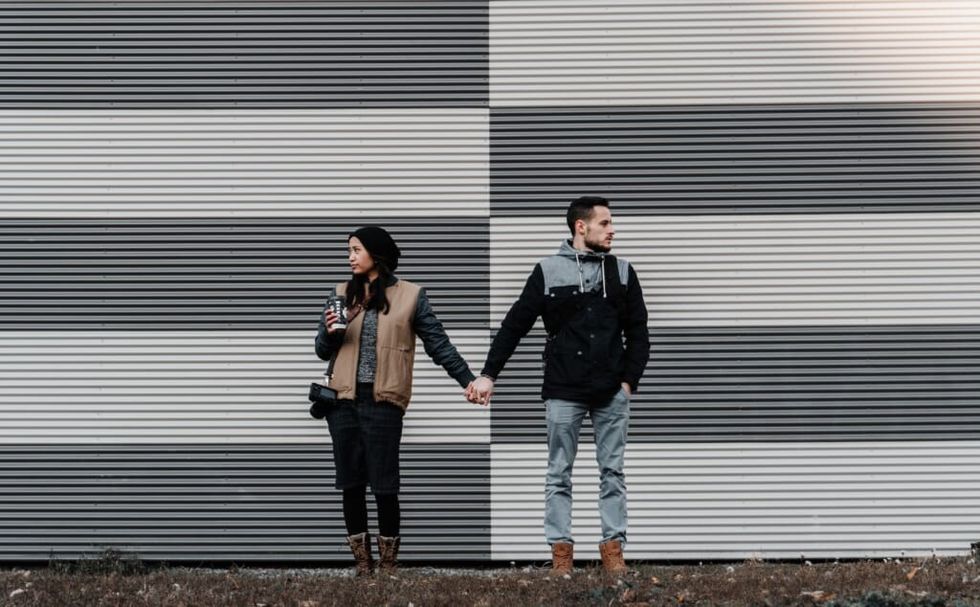couple is unhappy looking in opposite ways