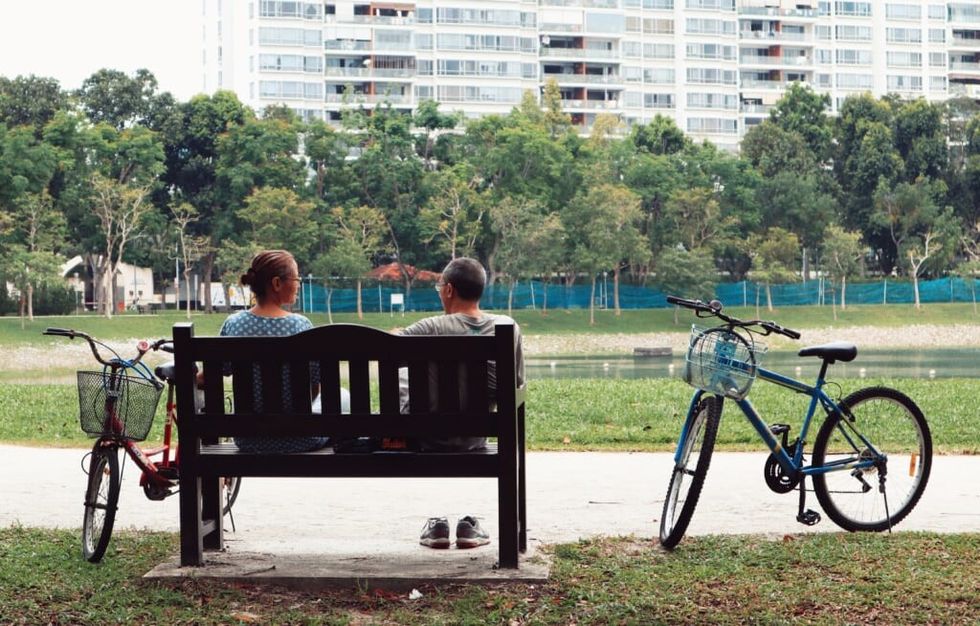 couple sit on bench outside