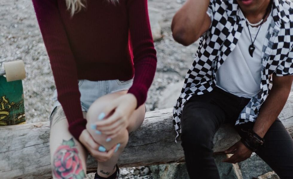 couple sitting outside discusses issues