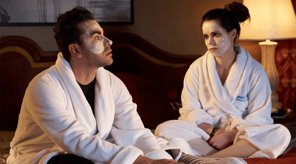 Daniel Levy as David Rose and Emily Hampshire as Steve Budd on Schitt's Creek