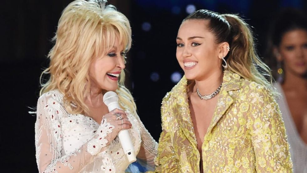 Dolly Parton and Miley Cyrus performing together on stage