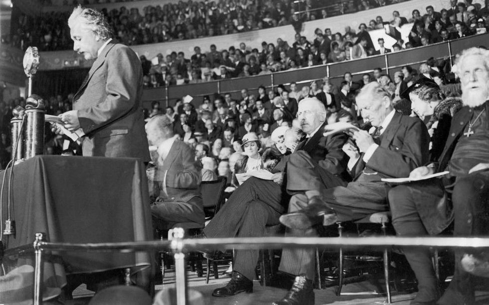 Einstein speaks at a conference