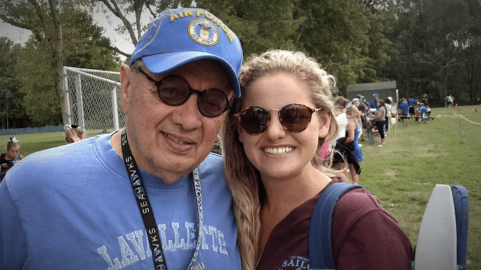 elderly man and his granddaughter wearing sunglasses