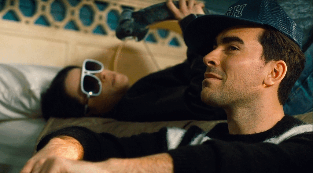 Emily Hampshire as Stevie Budd and Daniel Levy as David Rose on Schitt's Creek