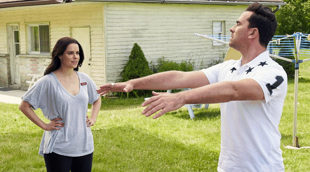 Emily Hampshire as Stevie Budd and Daniel Levy as David Rose on Schitt's Creek