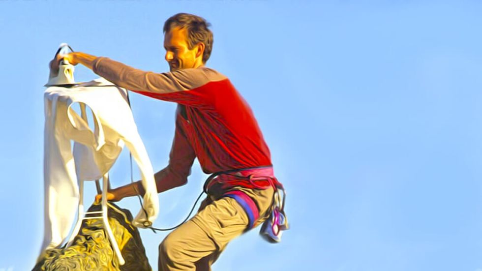 Extreme ironing on a mountain peak