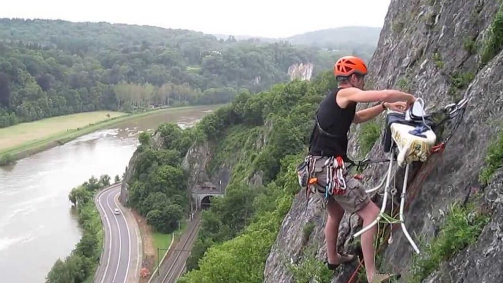 Extreme Ironing while rock climbing