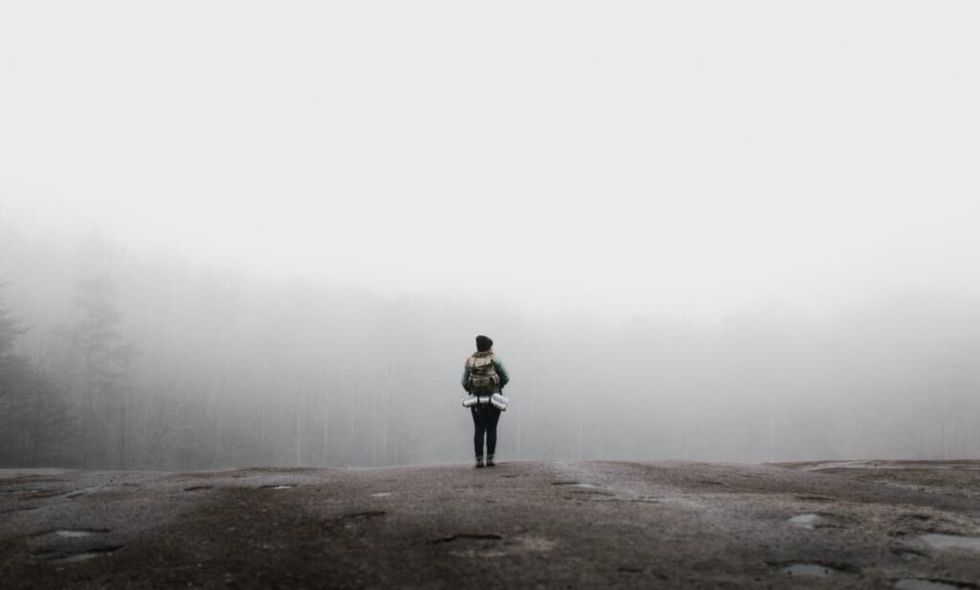 foggy day woman hiking