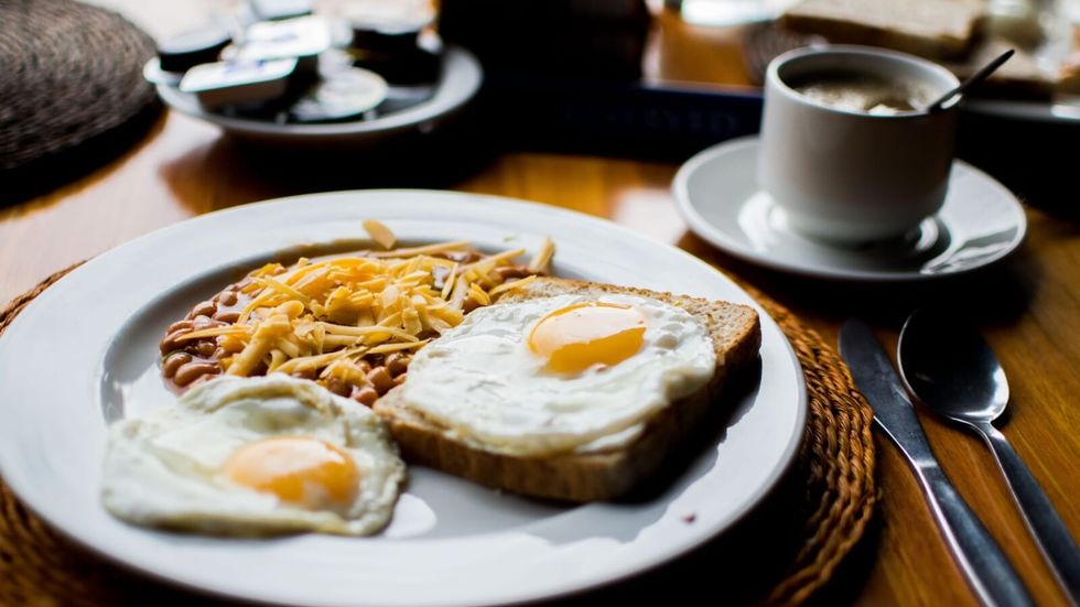 fried egg and toast on a breakfast table