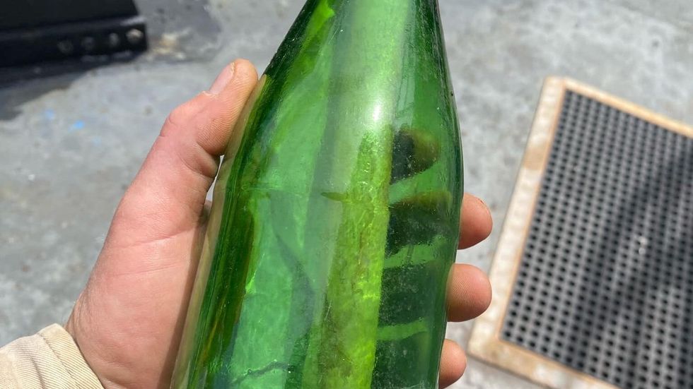 green bottle with a note inside