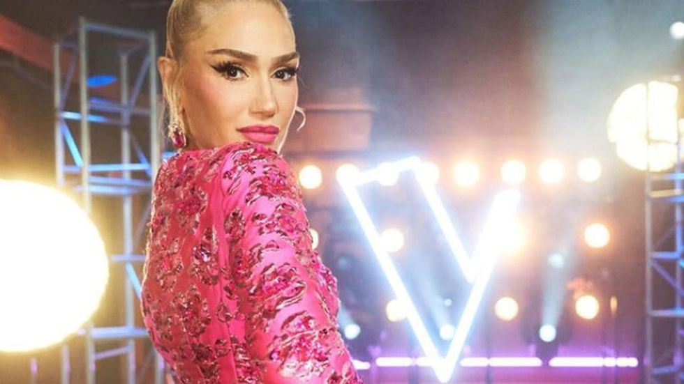 Gwen Stefani wearing a pink dress backstage on the voice