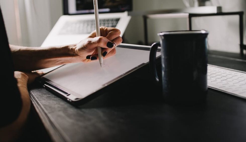 hand in a state of creation