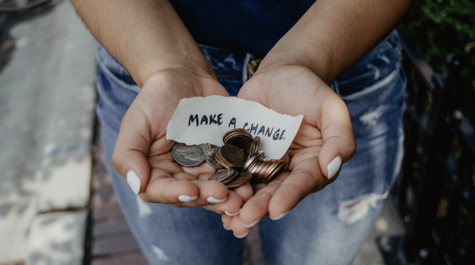 hand of change with paper sign