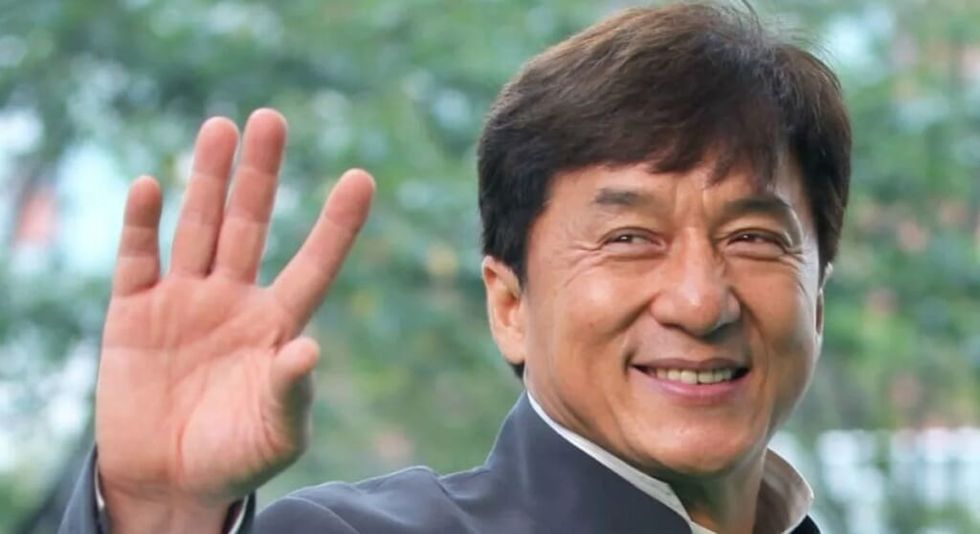 Jackie Chan waving at the camera